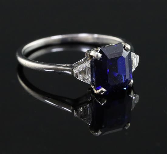 A 1940s? platinum, sapphire and diamond three stone ring, size J.